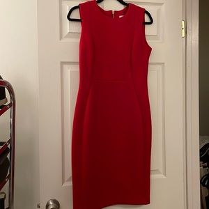 Figure flattering red Calvin Klein dress with gold hardware detail